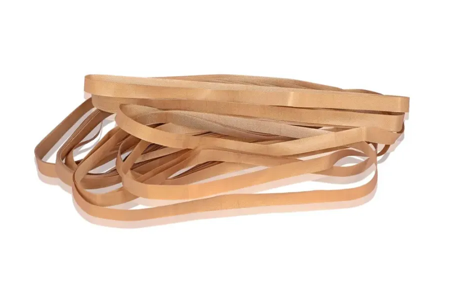Coiled Optiset PU cord Teflon belts showing the PTFE-coated woven surface