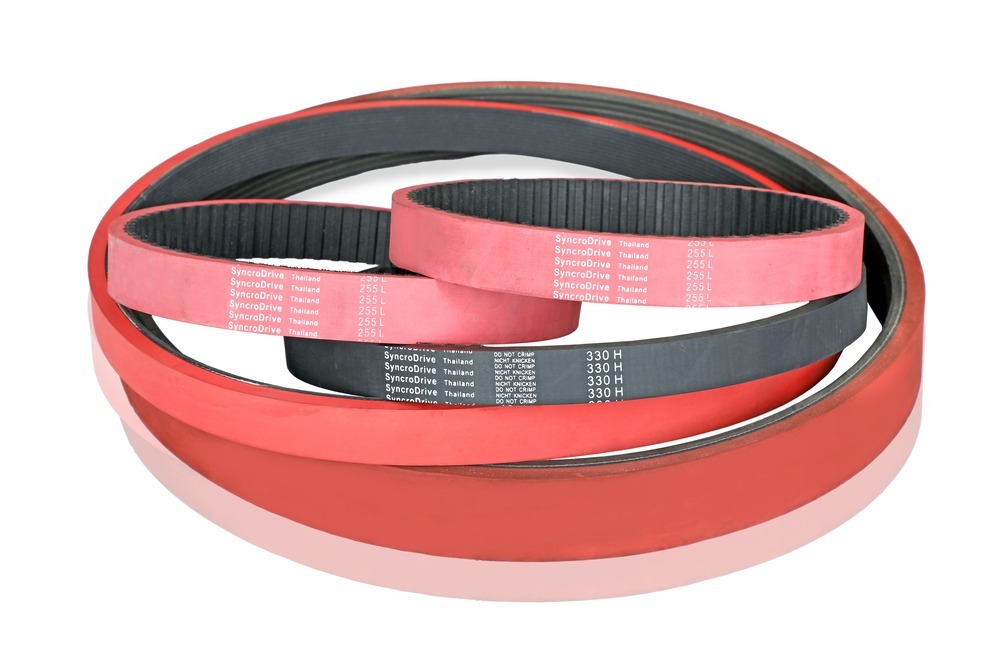 Coiled Optiset rubber timing belts showing toothed profile and SyncroDrive branding